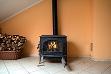 A flued heater that burns wood for heat. Any byproducts leave through the flue pipe in the back Good woodburning stove.jpg