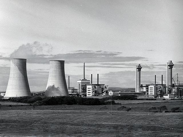 The site in 1956. In foreground Calder Hall cooling towers and two Magnox reactors. Background L to R: First Generation reprocessing plant, Windscale 