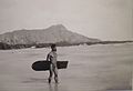 Hawaiian with surfboard and Diamond Head in the background.JPG