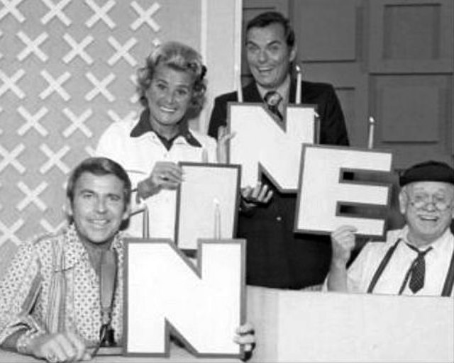 Celebrating the start of its ninth year on the air in 1974, (L–R) are Paul Lynde, Rose Marie, host Peter Marshall and Cliff Arquette as Charley Weaver