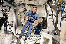 Expedition 43 commander and NASA astronaut Terry Virts shows off a special suit for his preparation process to return to Earth later. Virts tweeted this image with an explanation of the suits purpose on May 12, 2015: "Our "Penguin (pingvin)" suit- it compresses you, to get your body ready for the return to gravity". ISS-43 Terry Virts wears a 'Penguin' suit.jpg