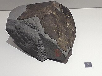 a photo of The ornans meteorite Meteorite Ornans, exposition Meteorites, Museum national d'histoire naturelle.jpg