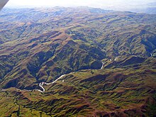 Deforestation of the Highland Plateau in Madagascar has led to extensive siltation and unstable flows of western rivers. Madagascar highland plateau.jpg