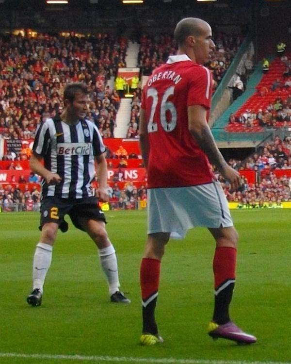 Obertan (right in the number 26 shirt) in a Manchester United shirt during Gary Neville's testimonial game against Juventus