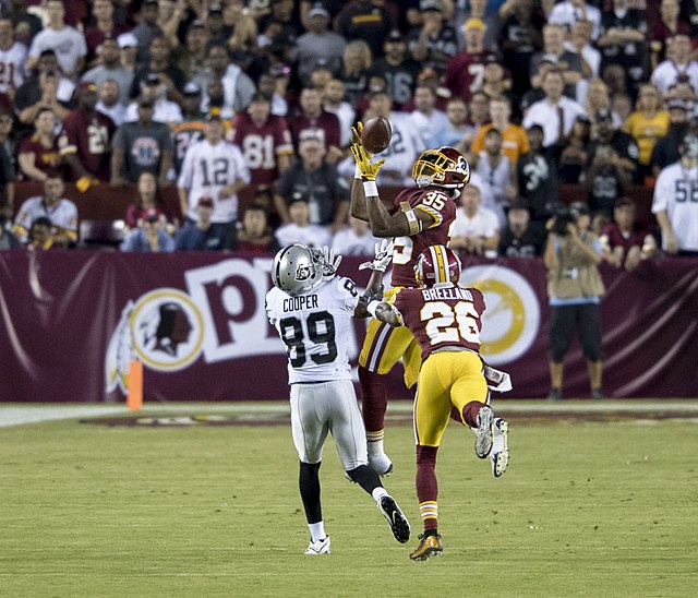 Montae Nicholson of the Washington Redskins makes an interception over Cooper.