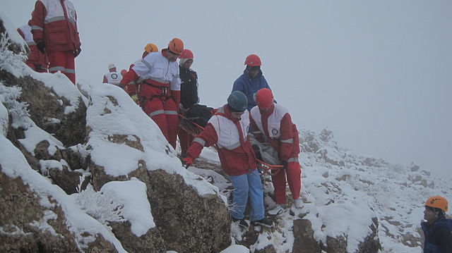 A mountain rescue team in Iran moving a casualty.