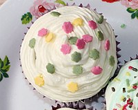A frosted muffin garnished with confetti candy Muffins with confetti candy.jpg