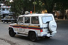 A Mumbai Police Mahindra Bolero patrol vehicle with amber lights and sirens. Mumbai Police Mahindra Bolero Patrol Car.jpg