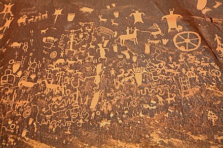 The first carvings at the Newspaper Rock State Historic Monument site were made around 2,000 years ago, left by people from the Archaic, Basketmaker, Fremont, and Pueblo cultures. Newspaper Rock closeup.jpg