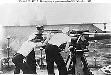 Boresighting the 3-inch/50-caliber gun on Ockenfels' fo'c's'le in 1917 Ockenfels boresighting 1917 NH 41712.jpg