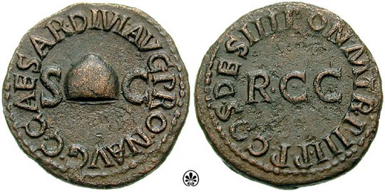 Quadrans celebrating the abolition of a tax in AD 38 by Caligula.[40] The obverse of the coin contains a picture of a Pileus which symbolizes the liberation of the people from the tax burden. Caption: C. CAESAR DIVI AVG. PRON[EPOS] (great-grandson of) AVG. / PON. M., TR. P. III, P. P., COS. DES. RCC. (probably Res Civium Conservatae, i.e. the interests of citizens have been preserved)