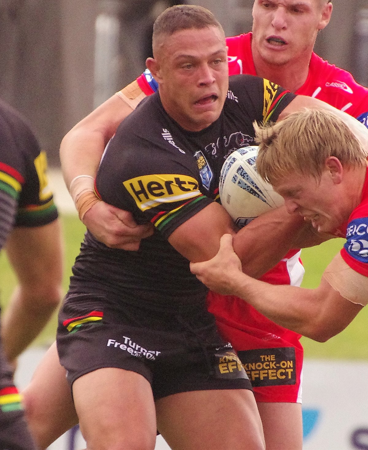 Scott Sorensen of the Panthers is tackled during the NRL Round 12 match  between the Brisbane Broncos and the Penrith Panthers at Suncorp Stadium in  Brisbane, Thursday, May 18, 2023. (AAP Image/Jono