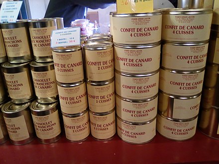 Tins of confit de canard are piled high in épiceries and supermarkets