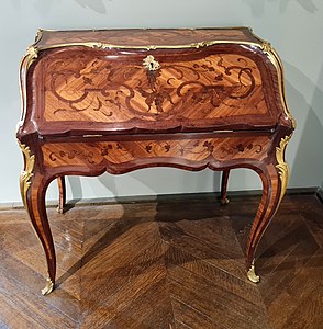 Rococo slant-top desk; c.1750; oak, kingwood marquetry, amaranth wood, satiné, gilt bronze; unknown dimensions; Musée des Arts Décoratifs (Paris)[60]