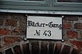 Historisches Straßenschild in Lübeck "Bäcker-Gang"