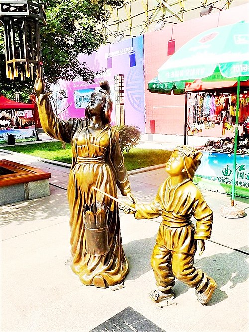 Statues of mother and daughter celebrating the Lantern Festival. Xi'an