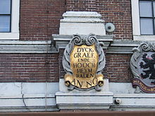 The first of a series of gablestones on a Gemeenlandshuis in Halfweg built in 1645; each stone represents the heraldic shield of the dike-reeve and his men, known as the heemraden, or in this case, the hoogheemraden Sugar city 5.jpg