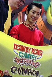 Japanese competitive eater Takeru Kobayashi at a Donkey Kong Country Returns launch event Takeru Kobayashi 2010.jpg