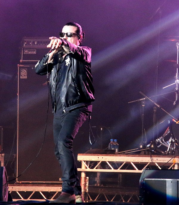 Astbury performing in 2018