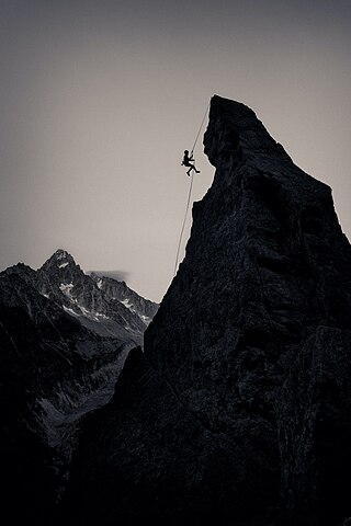 Photographer's comment: "The boy and the beast. Abseiling down the Aiguillette d'Argentière after climbing Rébuffat-Terray. No performance, just the atmosphere... The memory of the legendary rope team of Gaston Rébuffat and Lionel Terray to which this route pays homage, the Chamonix setting with the Aiguille du Chardonnet in the background, and this magical summer evening where everything seems both grandiose and extremely simple."