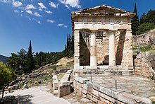 The reconstructed Treasury of the Athenians, built to commemorate their victory at the Battle of Marathon Treasury house of Athens in Delphi (July 2018).jpg
