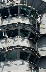 US Navy 120123-N-OY799-023 Airman James Campbell wipes down a window on the island aboard the Nimitz-class aircraft carrier USS John C. Stennis (CV.jpg