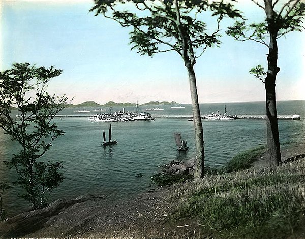 United States Navy warships off Zhifu in the 1930s. Several foreign warships were stationed at the town during the warlord rebellion to ensure the sec