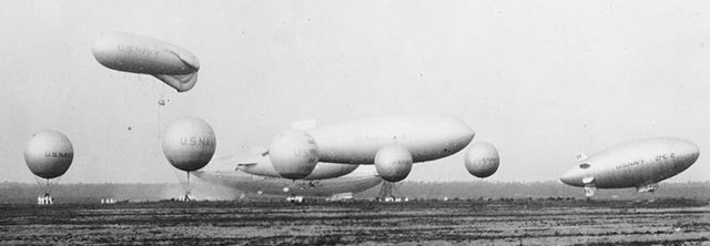 U.S. Navy airships and balloons, 1931: in the background, ZR-3, in front of it, (l to r) J-3 or 4, K-1, ZMC-2, in front of them, "Caquot" observation 