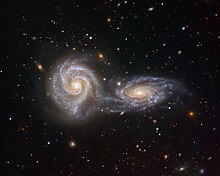 Two spiral galaxies are locked in a spellbinding, swirling dance in this image from the VIMOS instrument on ESO's Very Large Telescope (VLT). The two interacting galaxies -- NGC 5426 and NGC 5427 -- together form an intriguing astronomical object named Arp 271, the subject of this, the final image captured by VIMOS before it was decommissioned on 24 March 2018. VIMOS's last embrace NGC 5426 and NGC 5427.jpg