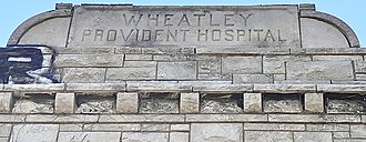 Etching above the east-facing front door Wheatley-Provident Hospital etching east roof.jpg