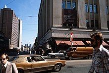 College Park in 1979. A sign on the building informing pedestrians of redevelopment works in the building. Yonge and College Streets 1979 Toronto.jpg