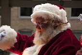 A man dressed as Santa Claus waves to children from an annual holiday train in Chicago, 2012. 20121123 SantaClaus-Chicago.JPG