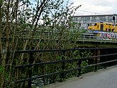 View on the railway embankment on the east side of Amsterdam city; FotoDutch, April 2013; photo, Fons Heijnsbroek