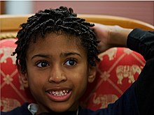 Short twists worn by a young boy Afro locs.jpg