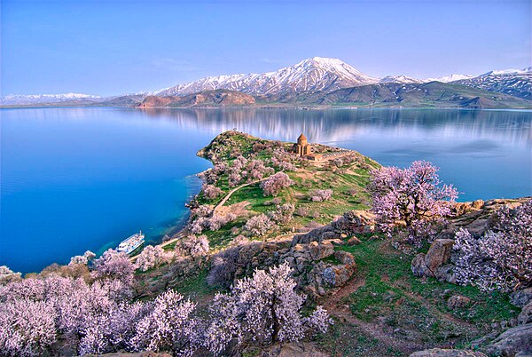 Akdamar Island and the Holy Cross Cathedral, a 10th-century Armenian church and monastic complex. Mount Artos (Mt. Çadır) is seen in the background.