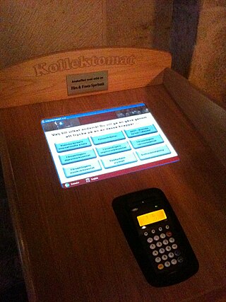 Kollektomat (collectomat), an automatic offertory machine with a card reader in Lund Cathedral, Sweden