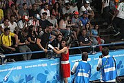 Deutsch: Boxen bei den Olympischen Jugendspielen 2018 Tag 12, 18. Oktober 2018 - Kampf um Bronze im Leichten Weltergewicht Jungen – Hassan Azim (Großbritannien, rot) schlägt Mohammed Boulaouja (Marokko, blau) RSC; Ringrichter ist Wulfren Olivares Peréz (Kolumbien). English: Boxing at the 2018 Summer Youth Olympics on 18 October 2018 – Bronze Medail Match Light Welterweight Boys - Hassan Azim (Great Britain, red) beats Mohammed Boulaouja (Morocco, blue) RSC; Referee is Wulfren Olivares Peréz (Columbia). Español: Boxeo en los Juegos Olímpicos Juveniles de Verano de 2018 en 18 de octubre de 2018 - Medalla de bronce de los hombres ligeros de peso welter: Hassan Azim (Gran Bretaña, rojo) vence a Mohammed Boulaouja (Marruecos, azul) RSC; El árbitro es Wulfren Olivares Peréz (Colombia).