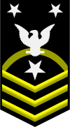Service dress blue rating badge for a CMC with more than 12 years of service