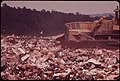 COVERING GARBAGE WITH ONE FOOT OF EARTH AT WESTCHESTER COUNTY'S CROTON LANDFILL OPERATION - NARA - 549946.jpg
