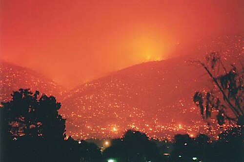 Canberra's suburban hills engulfed in flames during the bushfires.