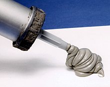 Silicone caulking extruded from a caulking gun Caulking.jpg