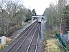 Church Stretton station looking north in 2009 with a train for Carmarthen at platform 2