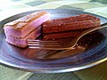 Slices of inipit flavoured with ube (purple yam) and chocolate, respectively.