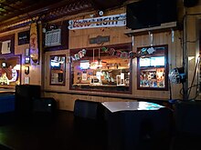 Stage with wooden wall adorned with mirrors