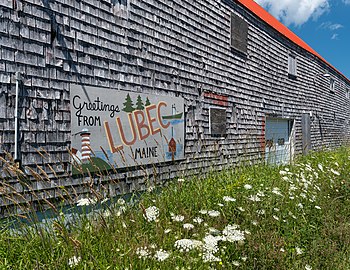 Greetings from Lubec sign on a warehouse, Lubec, Maine, US