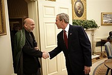 Bush with Afghanistan President Hamid Karzai Hamid Karzai being greeted by George W. Bush in 2005.jpg