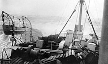 Kroonland pitches in heavy seas during a transatlantic crossing while in Navy service. Heavy seas aboard USS Kroonland, March 1919.jpg