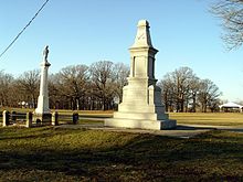 Monuments at the massacre site in Shabbona County Park, the older monument is on the left. Indian creek massacre memorials in Shabbona County Park.jpg