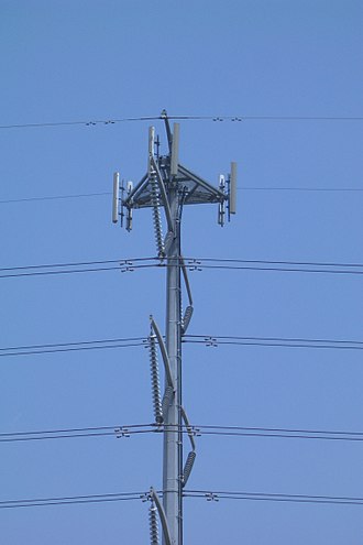 Cell antennas on an electricity pylon showing two antennas per sector IntegratedCellTower.jpg