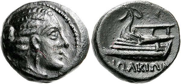 Coin of Iolcos, 4th century BC, depicting Argo. Obverse: Head of Artemis Iolkia. Reverse: Prow of Argo ΙΩΛΚΙΩΝ (of Iolcians).